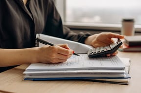 woman conducting audit to ensure there is no fraud occurring